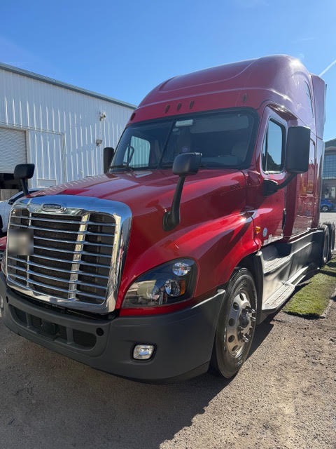 2017 Freightliner Cascadia after collision repair with repaired fiberglass hood, new headlight and new front bumper