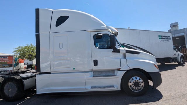 Completed passenger-side cab, sleeper, panels and steps on a repaired Freightliner Cascadia