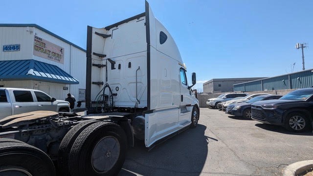 Rear three-quarter view of the repaired Freightliner Cascadia cab and sleeper outside The Spray Gun Autobody in Las Vegas