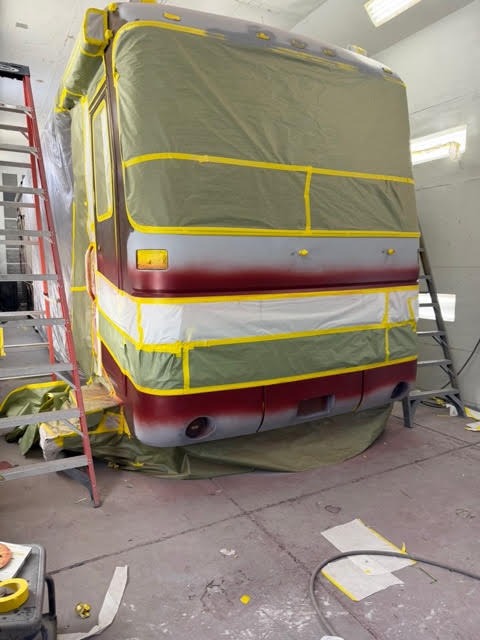 Motorhome masked and prepared in the paint booth for a paint refresh at The Spray Gun Autobody in Las Vegas