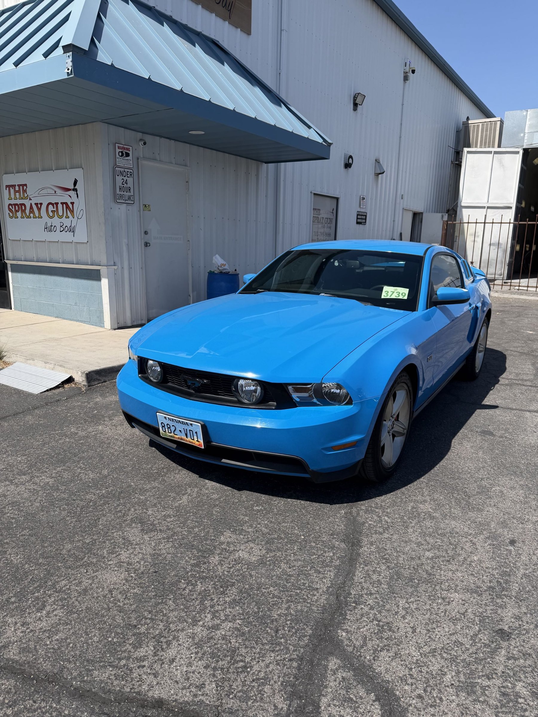 Ford Mustang GT after headlight replacement outside The Spray Gun Autobody in Las Vegas