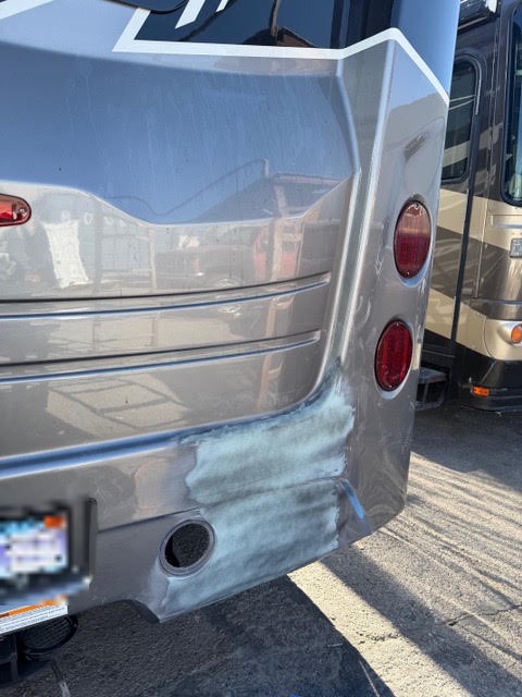 Rebuilt and primed rear fiberglass section on a Jayco Seneca motorhome prepared for paint
